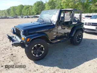 2004 Jeep Wrangler Sahara with VIN 1J4FA59S74P801296, listed as a IAAI auction lot 42049291 with 152,208 mi miles and . Bid and sale history available at DreamBid. Image 2.