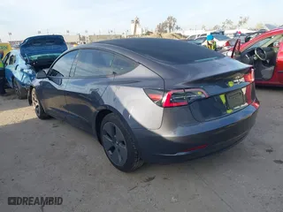 2023 Tesla Model 3 with VIN 5YJ3E1EA9PF569494, listed as a IAAI auction lot 41798014 with 18,372 mi miles. Bid and sale history available at carsss.com. Image 3.