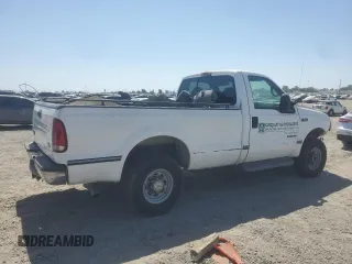 2000 Ford F-250 XL with VIN 1FTNF21F0YEC85459, listed as a Copart auction lot 63040505 with 328,049 mi miles and Salvage title. Bid and sale history available at DreamBid. Image 3.