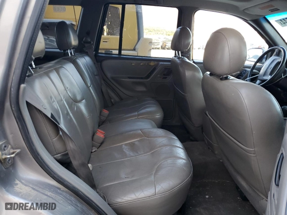 1999 Jeep Grand Cherokee Laredo with VIN 1J4GW58N9XC730311, listed as a Copart auction lot 77774544 with 0 mi miles and Salvage Title. Bid and sale history available at carsss.com. Image 11.