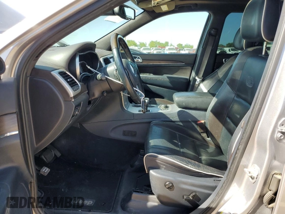2014 Jeep Grand Cherokee Overland with VIN 1C4RJFCG7EC153156, listed as a Copart auction lot 52452925 with 152,348 mi miles and Salvage Title. Bid and sale history available at DreamBid. Image 7.
