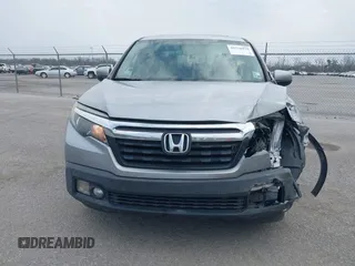 2019 Honda Ridgeline RTL with VIN 5FPYK2F50KB004055, listed as a IAAI auction lot 41576975 with 128,620 mi miles and . Bid and sale history available at DreamBid. Image 12.
