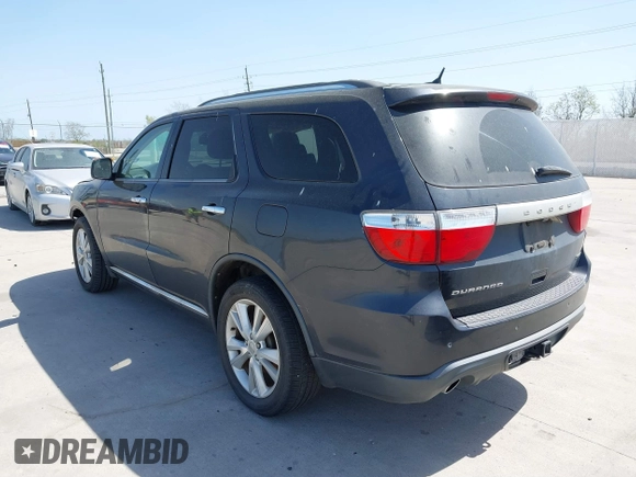 2013 Dodge Durango Crew with VIN 1C4SDHDT5DC637535, listed as a IAAI auction lot 41867982 with 162,569 mi miles and . Bid and sale history available at DreamBid. Image 3.