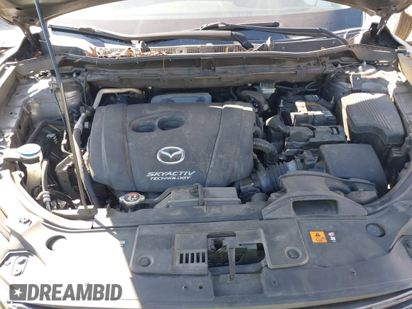 2016 Mazda CX-5 Grand Touring with VIN JM3KE4DY8G0823567, listed as a IAAI auction lot 41784384 with 143,836 mi miles and . Bid and sale history available at carsss.com. Image 10.