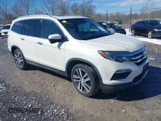 2017 Honda Pilot Touring with VIN 5FNYF6H95HB094641, listed as a IAAI auction lot 41531652 with 97,615 mi miles. Bid and sale history available at carsss.com. Image 1.