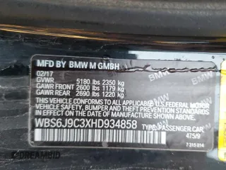 2017 BMW M6 z VIN WBS6J9C3XHD934858, wystawiony jako Copart lot #73714104 z przebiegiem Nie podano mil oraz Szkoda całkowita • Salvage title. Historia ofert i sprzedaży dostępna na DreamBid. Obrazek 12.