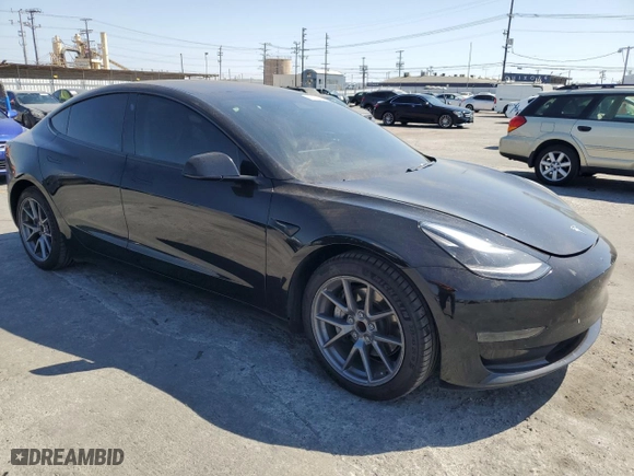 2021 Tesla Model 3 Standard Range Plus with VIN 5YJ3E1EAXMF069467, listed as a Copart auction lot 63273134 with 66,393 mi miles and Salvage Title. Bid and sale history available at carsss.com. Image 4.