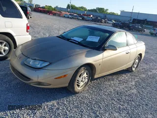 2001 Saturn SC with VIN 1G8ZR12741Z248708, listed as a IAAI auction lot 42044365 with 200,697 mi miles. Bid and sale history available at carsss.com. Image 2.