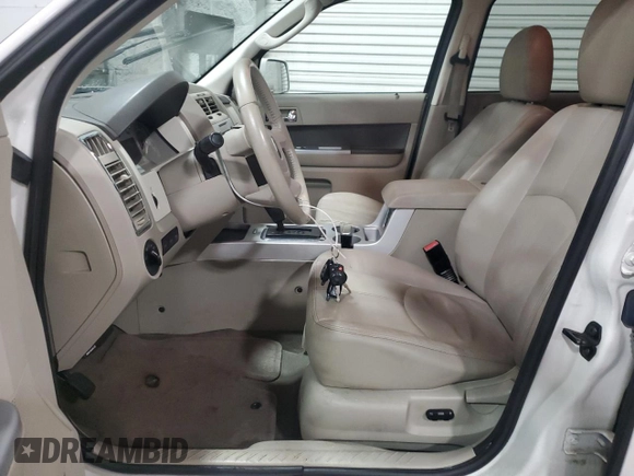 2009 Mercury Mariner Premier with VIN 4M2CU97G09KJ06145, listed as a Copart auction lot 47119525 with 158,430 mi miles and Salvage title. Bid and sale history available at DreamBid. Image 7.