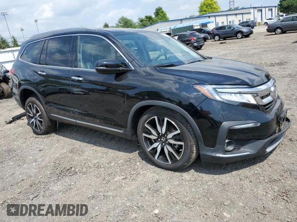 2020 Honda Pilot Touring 8-Passenger with VIN 5FNYF5H95LB021658, listed as a Copart auction lot 58878594 with 36,122 mi miles and Salvage Title. Bid and sale history available at DreamBid. Image 4.