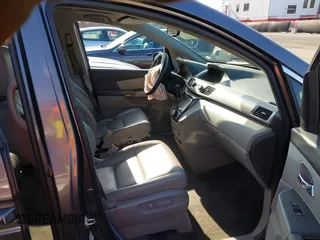 2015 Honda Odyssey Touring Elite z VIN 5FNRL5H9XFB067679, wystawiony jako IAAI lot #41913306 z przebiegiem 199 482 mil mil oraz . Historia ofert i sprzedaży dostępna na DreamBid. Obrazek 5.