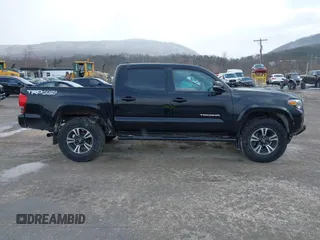 2016 Toyota Tacoma SR with VIN 3TMCZ5AN2GM027945, listed as a IAAI auction lot 41446277 with 51,781 mi miles and . Bid and sale history available at DreamBid. Image 14.