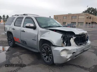 2010 GMC Yukon SLT with VIN 1GKUKCE00AR263094, listed as a IAAI auction lot 39319728 with 116,884 mi miles. Bid and sale history available at carsss.com. Image 1.