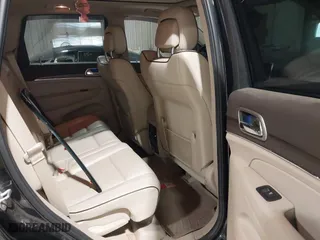 2014 Jeep Grand Cherokee Overland with VIN 1C4RJFCGXEC162109, listed as a IAAI auction lot 41943979 with 147,788 mi miles. Bid and sale history available at carsss.com. Image 8.