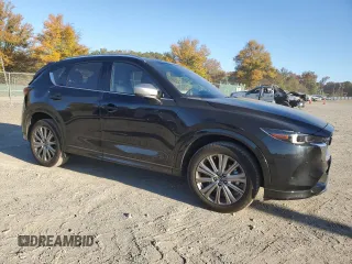 2024 Mazda CX-5 2.5 Turbo Signature with VIN JM3KFBXY8R0398139, listed as a Copart auction lot 76885954 with 7,266 mi miles and Salvage Title. Bid and sale history available at carsss.com. Image 4.