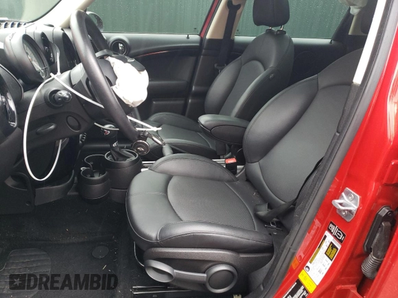 2014 MINI Countryman S with VIN WMWZC3C52EWP25379, listed as a Copart auction lot 61438355 with 76,943 mi miles and Salvage title. Bid and sale history available at DreamBid. Image 7.