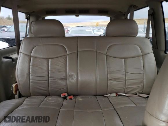 1999 GMC Safari z VIN 1GKEL19W4XB506220, wystawiony jako Copart lot #77257424 z przebiegiem 151 966 mil mil oraz Czysty tytuł • Clean title. Historia ofert i sprzedaży dostępna na DreamBid. Obrazek 10.