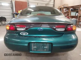 1996 Ford Taurus GL z VIN 1FALP52U5TG110582, wystawiony jako IAAI lot #40858639 z przebiegiem 57 965 mil mil oraz . Historia ofert i sprzedaży dostępna na DreamBid. Obrazek 16.