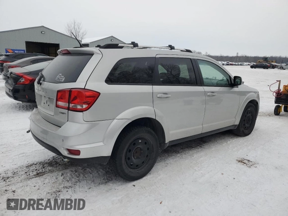 2013 Dodge Journey Crew with VIN 3C4PDCCG4DT698618, listed as a Copart auction lot 87632875 with 198,284 mi miles and Salvage title. Bid and sale history available at DreamBid. Image 3.