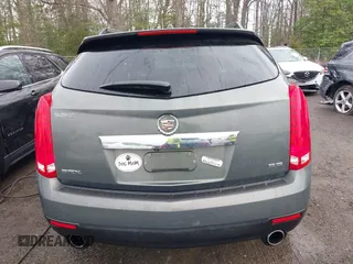 2013 Cadillac SRX Luxury Collection z VIN 3GYFNCE34DS550410, wystawiony jako IAAI lot #41917636 z przebiegiem 66 437 mil mil oraz . Historia ofert i sprzedaży dostępna na DreamBid. Obrazek 16.