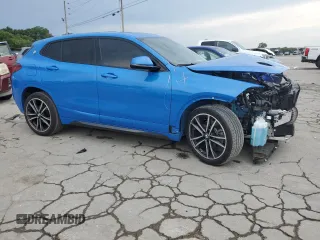 2023 BMW X2 sDrive28i with VIN WBXYH9C08P5V32303, listed as a Copart auction lot 64951994 with 22,462 mi miles and Salvage Title. Bid and sale history available at carsss.com. Image 4.