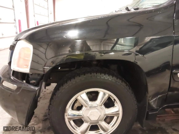 2004 GMC Envoy SLE with VIN 1GKDT13S542265104, listed as a IAAI auction lot 41884797 with 154,190 mi miles. Bid and sale history available at carsss.com. Image 20.