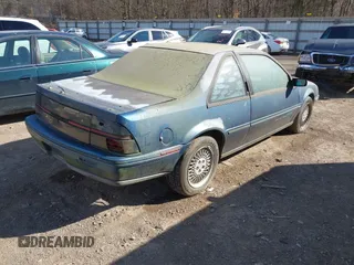 1991 Chevrolet Beretta z VIN 1G1LW13T4ME161251, wystawiony jako IAAI lot #41663013 z przebiegiem 179 803 mil mil oraz . Historia ofert i sprzedaży dostępna na DreamBid. Obrazek 4.