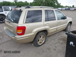 1999 Jeep Grand Cherokee Limited with VIN 1J4GW68SXXC664055, listed as a IAAI auction lot 42339125 with 219,792 mi miles and . Bid and sale history available at DreamBid. Image 4.