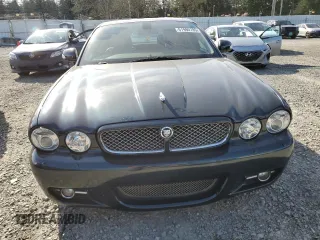 2008 Jaguar XJ with VIN SAJWA79BX8SH23430, listed as a Copart auction lot 51990785 with 140,454 mi miles and Salvage Title. Bid and sale history available at carsss.com. Image 5.