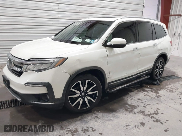 2019 Honda Pilot Touring 7-Passenger with VIN 5FNYF6H64KB005798, listed as a IAAI auction lot 41551933 with 103,151 mi miles. Bid and sale history available at carsss.com. Image 2.