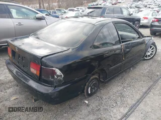 1997 Honda Civic DX with VIN 1HGEJ6125VL095006, listed as a IAAI auction lot 41473812 with 264,966 mi miles. Bid and sale history available at carsss.com. Image 4.