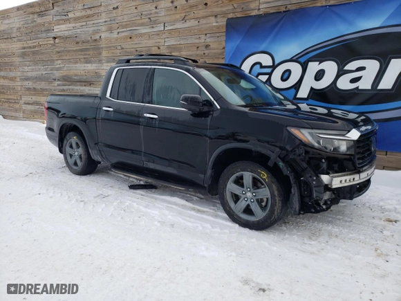 2021 Honda Ridgeline RTL-E with VIN 5FPYK3F79MB010074, listed as a Copart auction lot 83973564 with 44,058 mi miles and Clean Title. Bid and sale history available at carsss.com. Image 4.