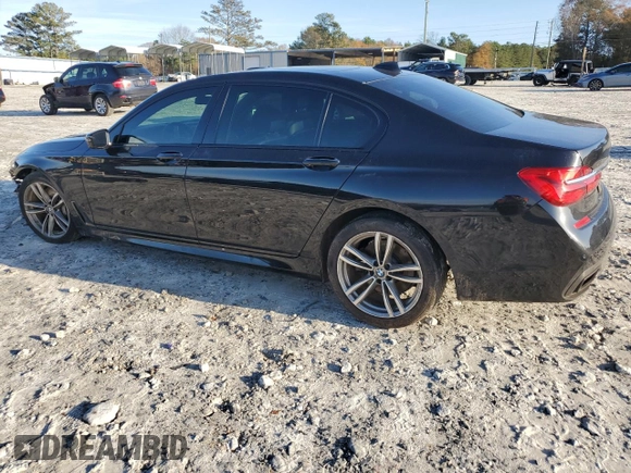 2016 BMW 7 Series 750i with VIN WBA7F0C5XGGL99048, listed as a Copart auction lot 84815364 with 96,743 mi miles and Salvage Title. Bid and sale history available at carsss.com. Image 2.