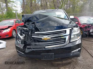 2015 Chevrolet Suburban LTZ with VIN 1GNSKKKC5FR255373, listed as a IAAI auction lot 42012528 with 219,030 mi miles and . Bid and sale history available at DreamBid. Image 12.