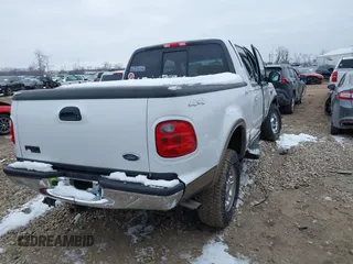 2002 Ford F-150 XLT with VIN 1FTRW08L12KA67332, listed as a IAAI auction lot 41617397 with 41,099 mi miles. Bid and sale history available at carsss.com. Image 4.