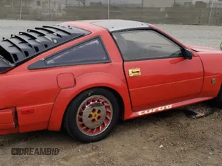 1984 Nissan 300ZX z VIN JN1CZ14SXEX009648, wystawiony jako Copart lot #56090024 z przebiegiem 48 776 mil mil oraz Szkody całkowita. Historia ofert i sprzedaży dostępna na DreamBid. Obrazek 3.