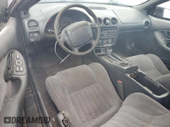 1999 Pontiac Firebird Firebird z VIN 2G2FS22K6X2208489, wystawiony jako Copart lot #79930994 z przebiegiem 181 964 mil mil oraz Czysty tytuł • Clean title. Historia ofert i sprzedaży dostępna na DreamBid. Obrazek 8.