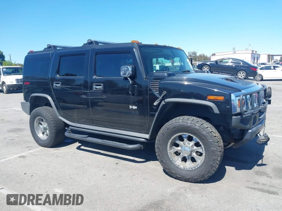 2003 Hummer H2 z VIN 5GRGN23U63H117676, wystawiony jako IAAI lot #41816411 z przebiegiem Nie podano mil oraz . Historia ofert i sprzedaży dostępna na DreamBid. Obrazek 13.