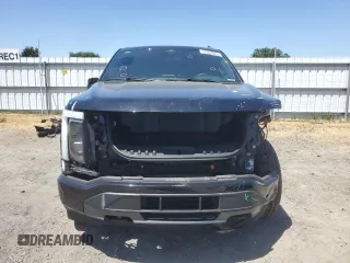 2023 Ford F-150 Lightning Pro with VIN 1FTVW1EV1PWG17333, listed as a Copart auction lot 57904025 with 21,173 mi miles and Salvage title. Bid and sale history available at DreamBid. Image 5.