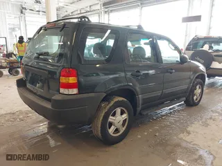 2003 Ford Escape XLS Popular with VIN 1FMYU02143KC35891, listed as a IAAI auction lot 41599760 with 148,381 mi miles. Bid and sale history available at carsss.com. Image 4.