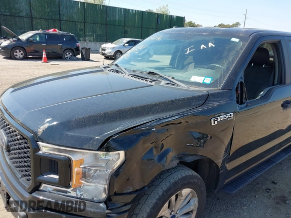 2018 Ford F-150 XL with VIN 1FTEW1EP2JFE13018, listed as a IAAI auction lot 42040276 with 97,563 mi miles. Bid and sale history available at carsss.com. Image 6.