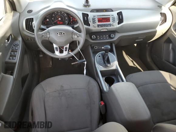 2012 Kia Sportage LX with VIN KNDPBCA21C7233424, listed as a Copart auction lot 61829465 with 129,526 mi miles and Salvage title. Bid and sale history available at DreamBid. Image 8.