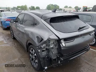 2021 Ford Mustang Mach-E Premium z VIN 3FMTK3R74MMA27709, wystawiony jako IAAI lot #42102335 z przebiegiem 54 988 mil mil oraz . Historia ofert i sprzedaży dostępna na DreamBid. Obrazek 3.