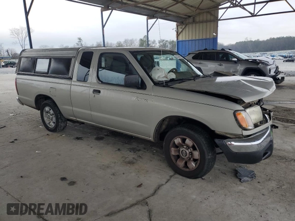 1999 Nissan Frontier XE with VIN 1N6DD26SXXC344449, listed as a Copart auction lot 43748015 with 137,318 mi miles and Salvage title. Bid and sale history available at DreamBid. Image 4.