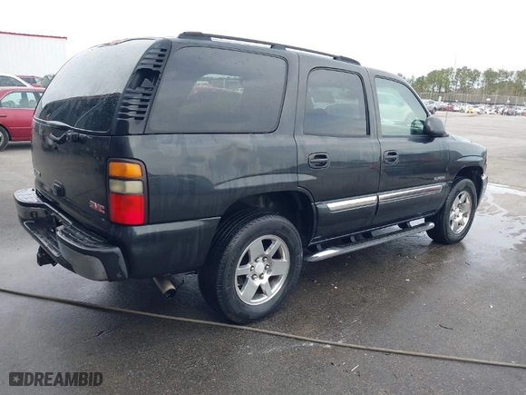 2005 GMC Yukon SLT with VIN 1GKEC13T75R144645, listed as a IAAI auction lot 41703999 with 222,585 mi miles. Bid and sale history available at carsss.com. Image 4.