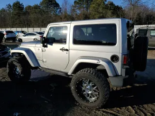 2011 Jeep Wrangler Sahara with VIN 1J4GA5D14BL628876, listed as a Copart auction lot 87317374 with 84,179 mi miles and Salvage Title. Bid and sale history available at DreamBid. Image 2.