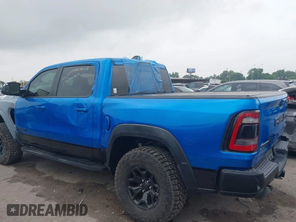 2021 Ram 1500 TRX with VIN 1C6SRFU91MN790158, listed as a IAAI auction lot 42115253 with 30,969 mi miles and . Bid and sale history available at DreamBid. Image 3.