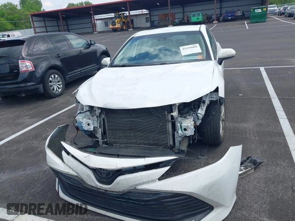 2019 Toyota Camry LE with VIN 4T1B11HK2KU743445, listed as a IAAI auction lot 42129688 with 284,938 mi miles and . Bid and sale history available at DreamBid. Image 12.