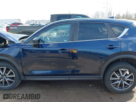 2018 Mazda CX-5 Touring with VIN JM3KFBCM5J0369799, listed as a IAAI auction lot 41895364 with 76,801 mi miles and . Bid and sale history available at carsss.com. Image 14.