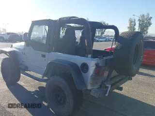 2005 Jeep Wrangler X with VIN 1J4FA39S55P348432, listed as a IAAI auction lot 41868451 with 166,876 mi miles. Bid and sale history available at carsss.com. Image 3.